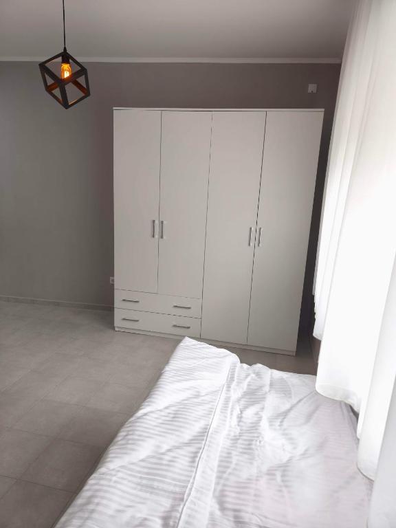 Katil atau katil-katil dalam bilik di Apartmani Trastevere Sombor