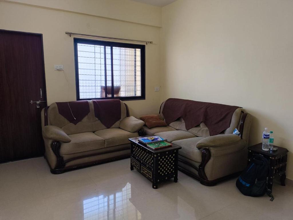 Posezení v ubytování 1BHK Cozy Stay