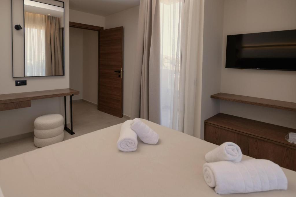 Postel nebo postele na pokoji v ubytování The Z Suites