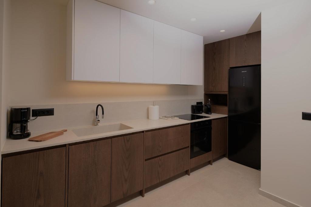 Kuchyň nebo kuchyňský kout v ubytování The Z Suites