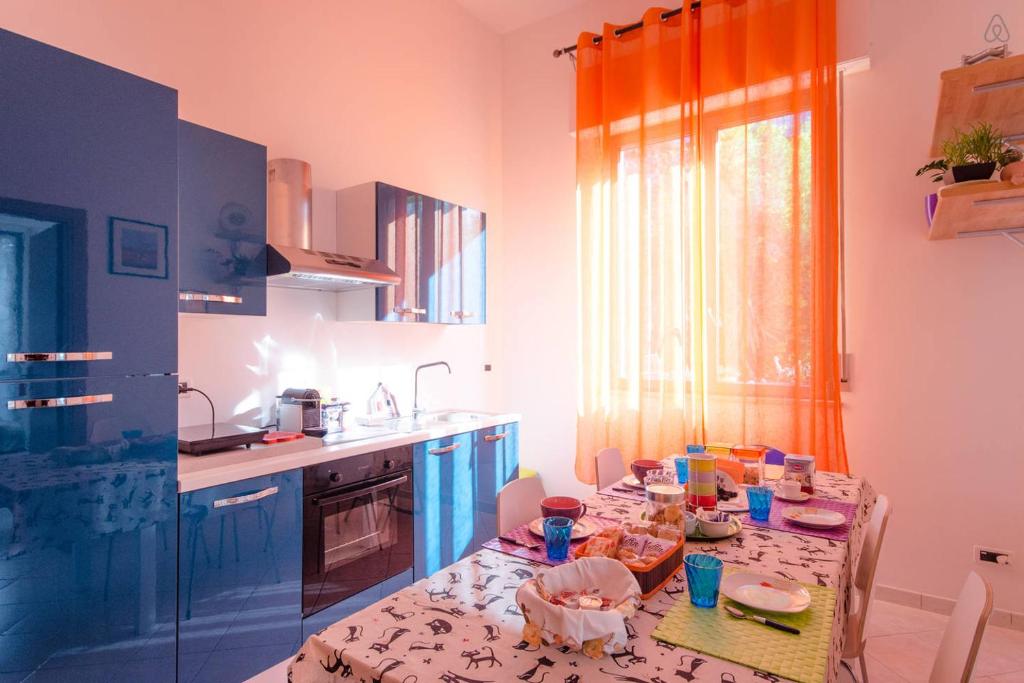 a kitchen with a table with food on it at Casa Martina in Pescara