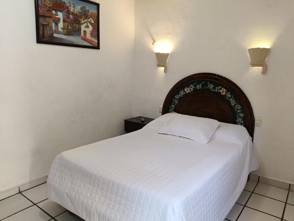Postel nebo postele na pokoji v ubytování Hotel Rath