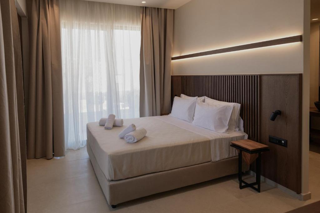 Postel nebo postele na pokoji v ubytování The Z Suites