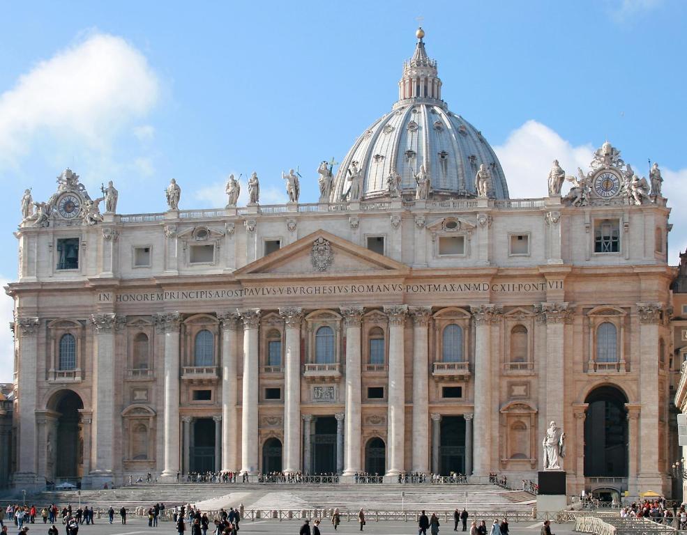 a large building with a dome on top of it at Lovely 5 min walk to Saint Peter Basilica in Rome