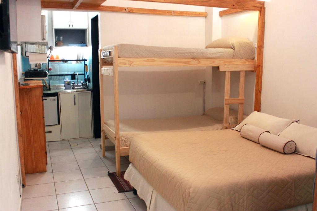 Una cama o camas en una habitación de Loft Mendoza Capital Musica y Fotografia