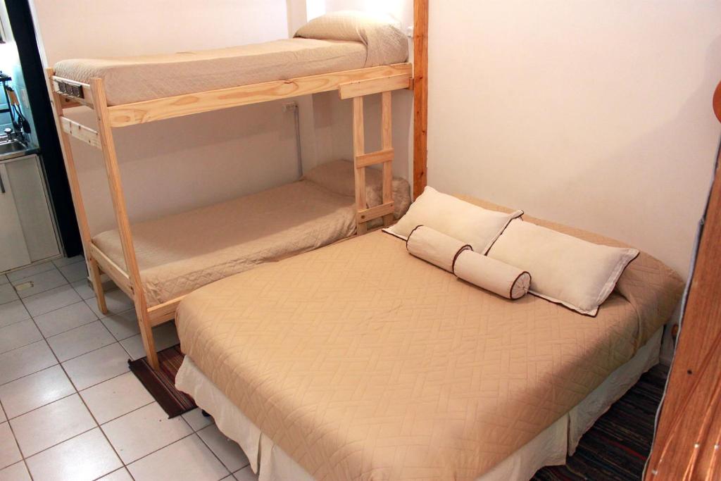 Una cama o camas en una habitación de Loft Mendoza Capital Musica y Fotografia