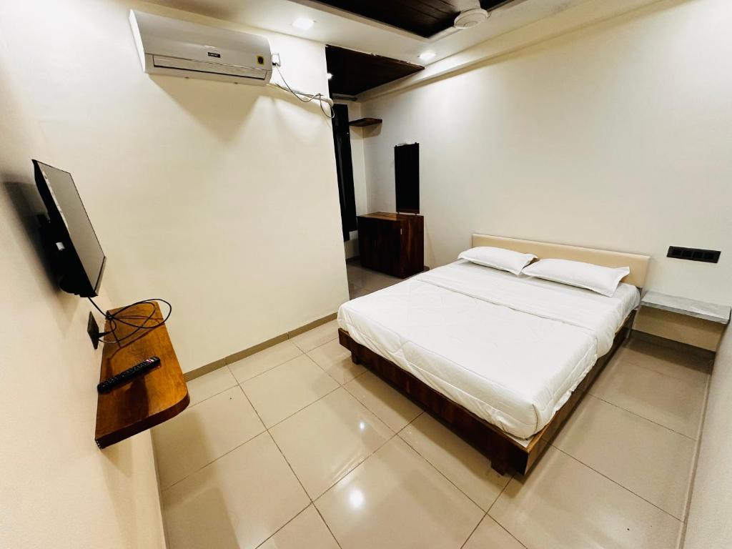 Postel nebo postele na pokoji v ubytování ParNam Hotel