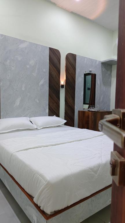 Postel nebo postele na pokoji v ubytování ParNam Hotel