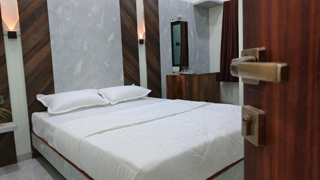 Postel nebo postele na pokoji v ubytování ParNam Hotel
