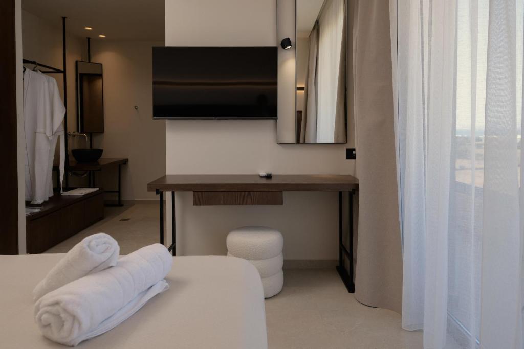 Postel nebo postele na pokoji v ubytování The Z Suites