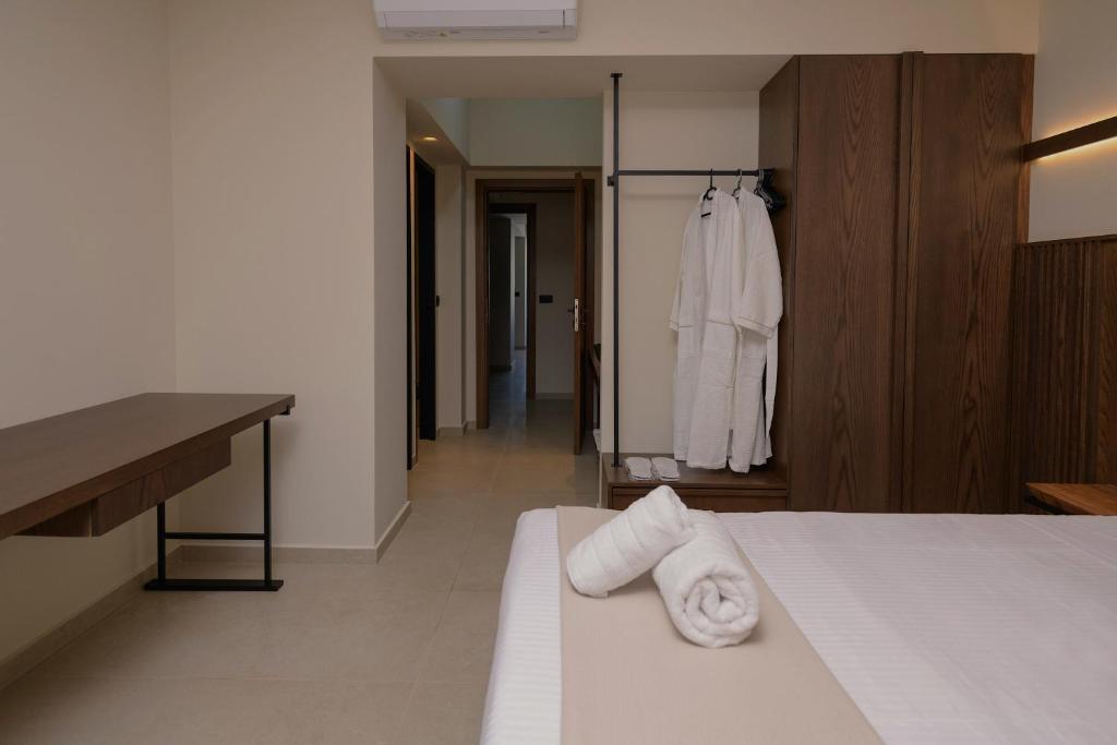 Postel nebo postele na pokoji v ubytování The Z Suites