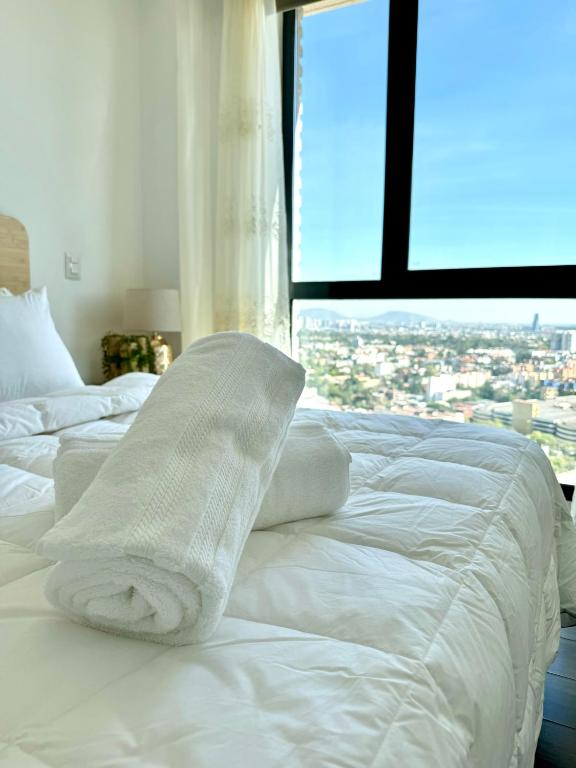 Ένα ή περισσότερα κρεβάτια σε δωμάτιο στο Skyline Suite in Polanco Best Location Fast Wifi