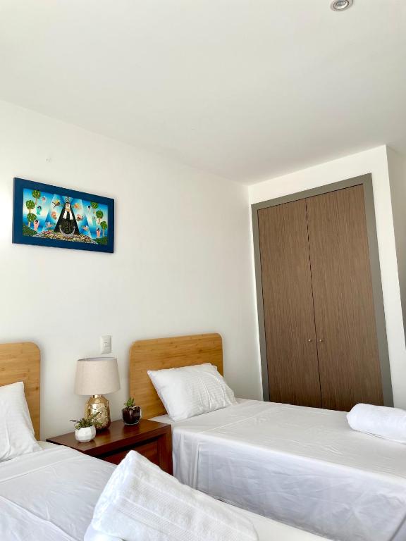 Ένα ή περισσότερα κρεβάτια σε δωμάτιο στο Skyline Suite in Polanco Best Location Fast Wifi