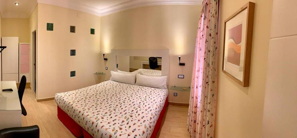 Postel nebo postele na pokoji v ubytování Hostal Arco Iris