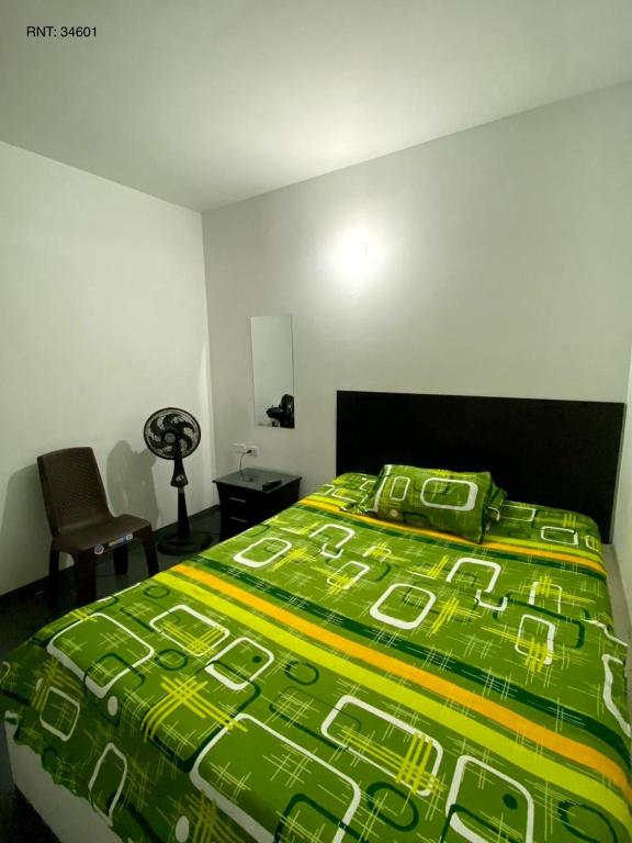 Una cama o camas en una habitación de Hospedaje DJ