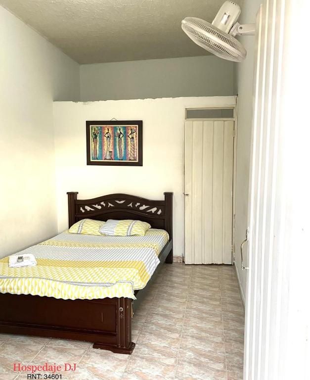 Una cama o camas en una habitación de Hospedaje DJ