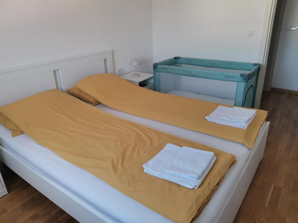 Postel nebo postele na pokoji v ubytování Apartman Luni