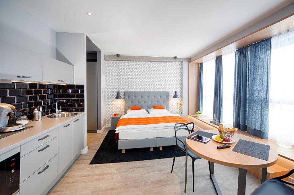 Postel nebo postele na pokoji v ubytování MLOFT Apartments München