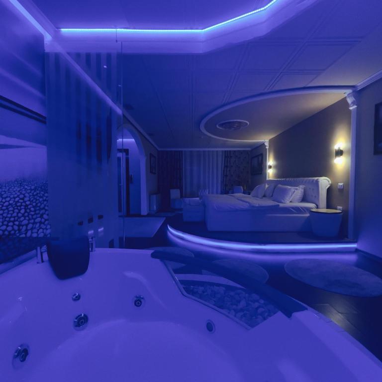 Llit o llits en una habitació de Hotel Rosa Blu