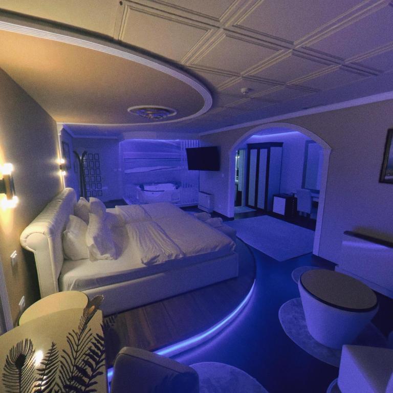 Llit o llits en una habitació de Hotel Rosa Blu
