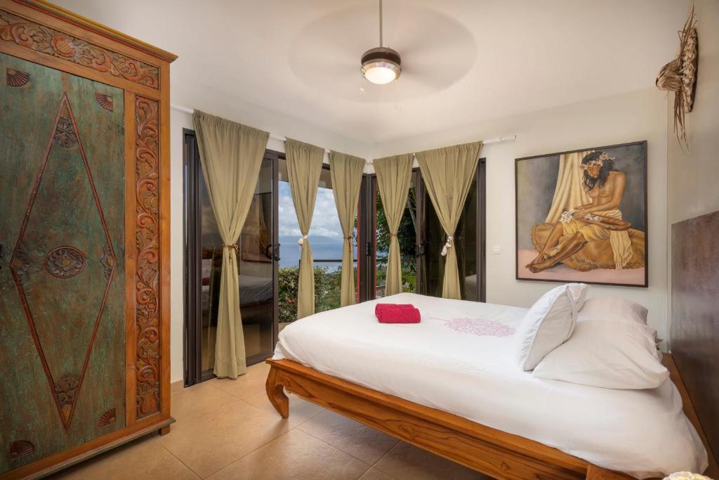 Postel nebo postele na pokoji v ubytování Magnifique Villa Vue Mer exceptionnelle - Ireina