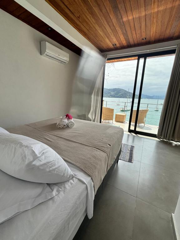 Postel nebo postele na pokoji v ubytování Flats Praia Comprida