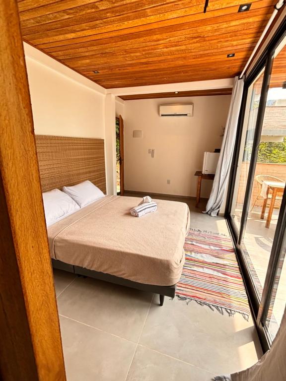Postel nebo postele na pokoji v ubytování Flats Praia Comprida