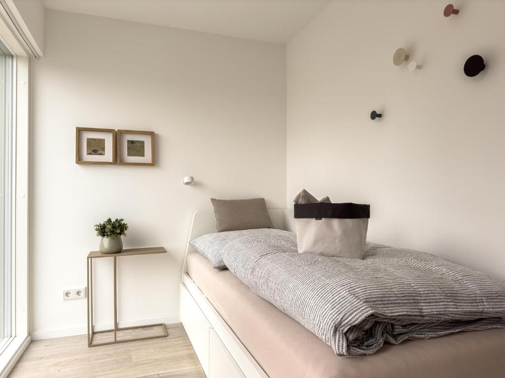 Postel nebo postele na pokoji v ubytování Scandi Micro House