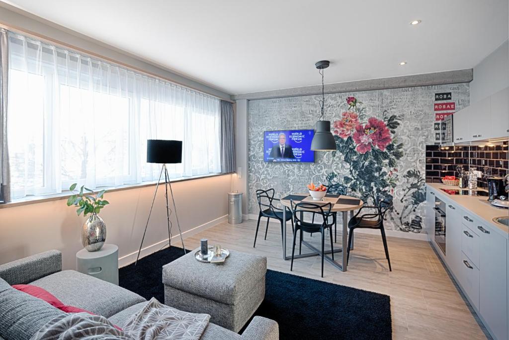 TV a/nebo společenská místnost v ubytování MLOFT Apartments München
