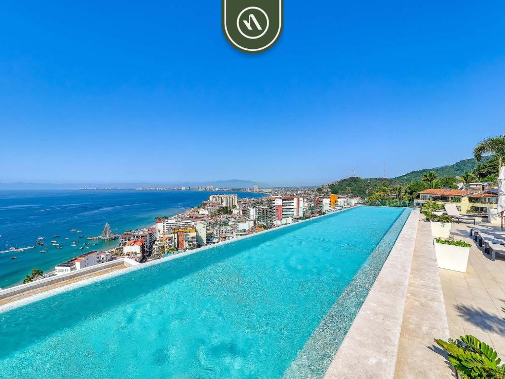 Hotel terrace with rooftop pool and ocean views in Puerto Vallarta