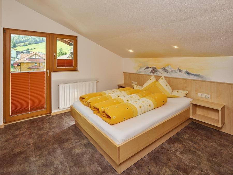Postel nebo postele na pokoji v ubytování Haus Gritsch