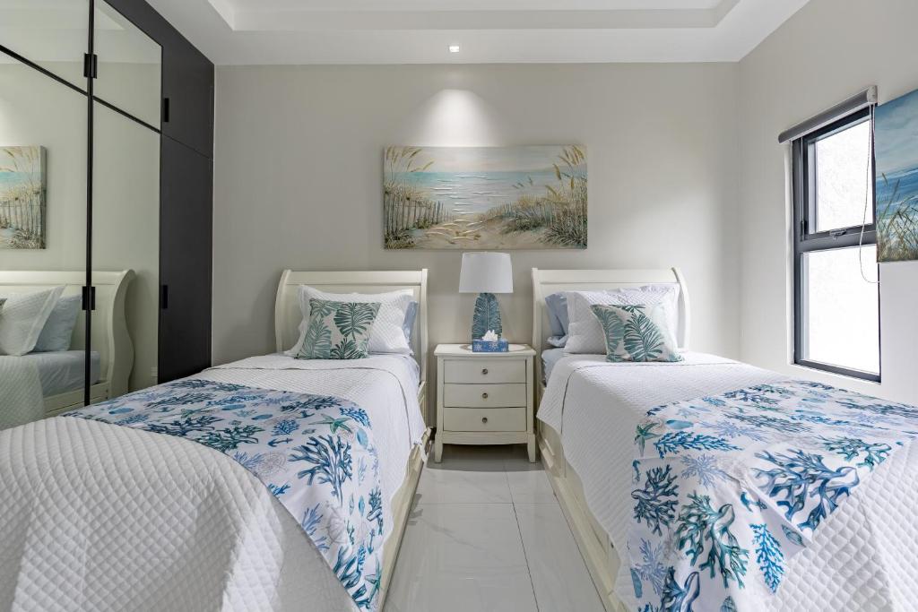 Postel nebo postele na pokoji v ubytování Vena Villas, Ocho Rios, Beach Property