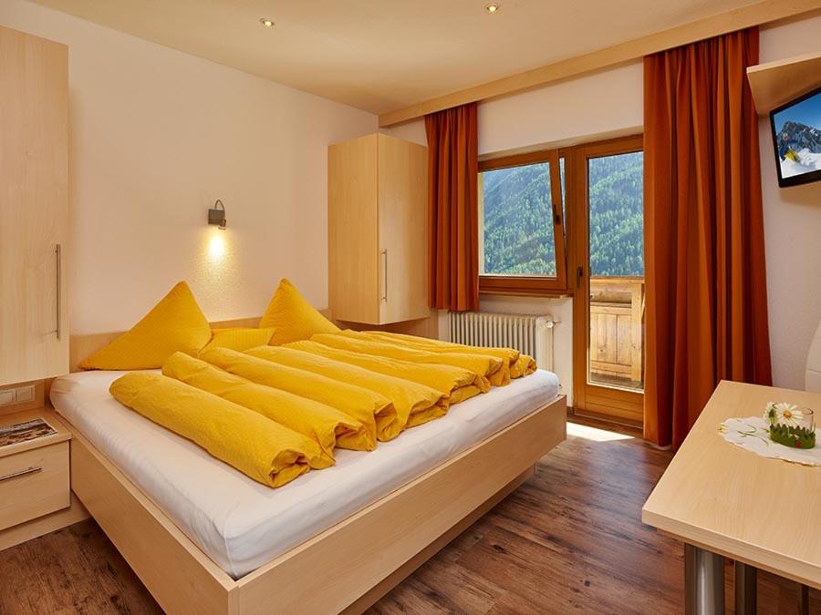 Postel nebo postele na pokoji v ubytování Haus Gritsch