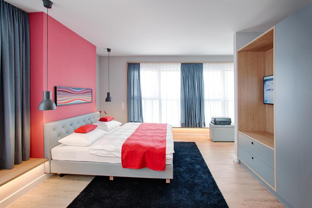 Postel nebo postele na pokoji v ubytování MLOFT Apartments München