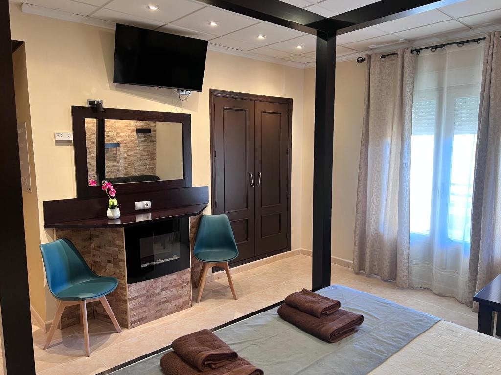 Postel nebo postele na pokoji v ubytování Hotel Don Juan