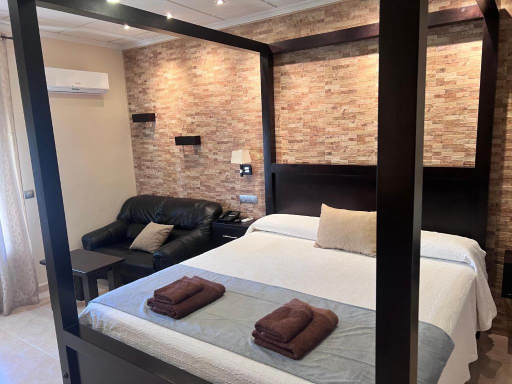 Postel nebo postele na pokoji v ubytování Hotel Don Juan