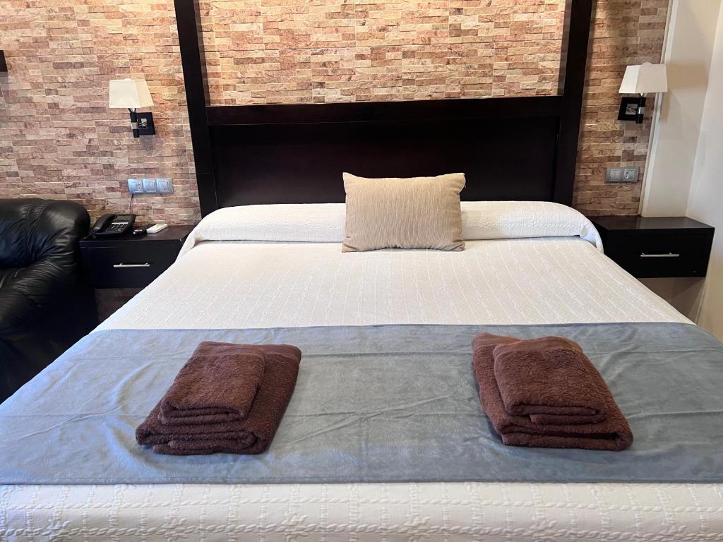 Postel nebo postele na pokoji v ubytování Hotel Don Juan
