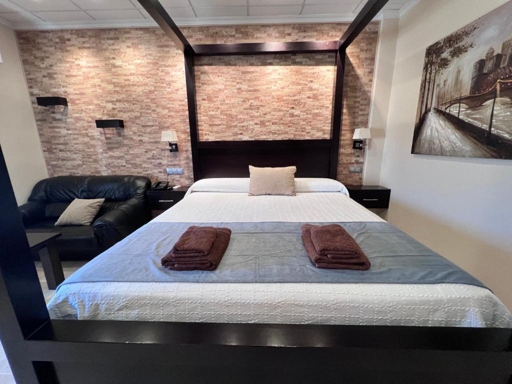 Postel nebo postele na pokoji v ubytování Hotel Don Juan