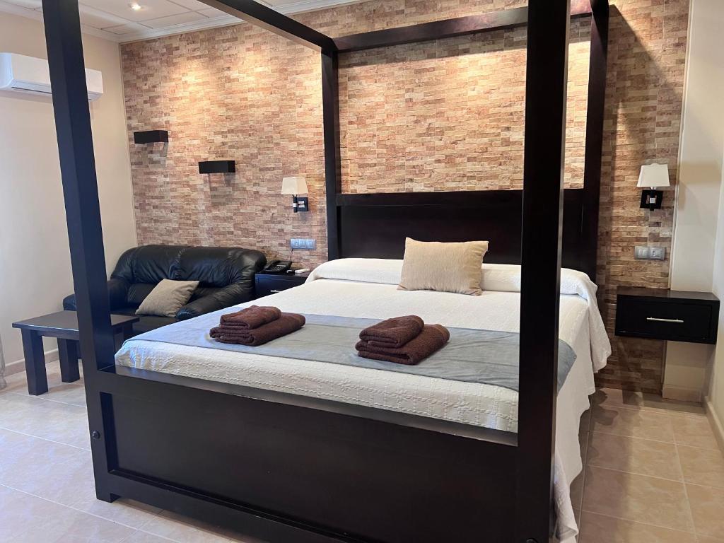 Postel nebo postele na pokoji v ubytování Hotel Don Juan