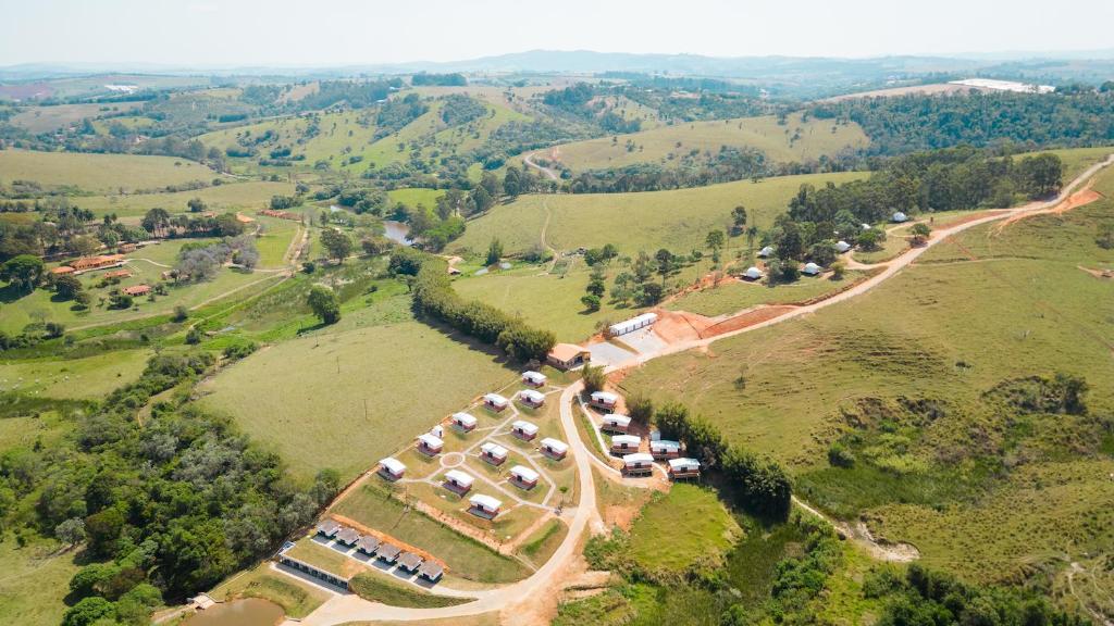 an aerial view of a group of tents on a hill at Monakó Cabanas in Bragança Paulista