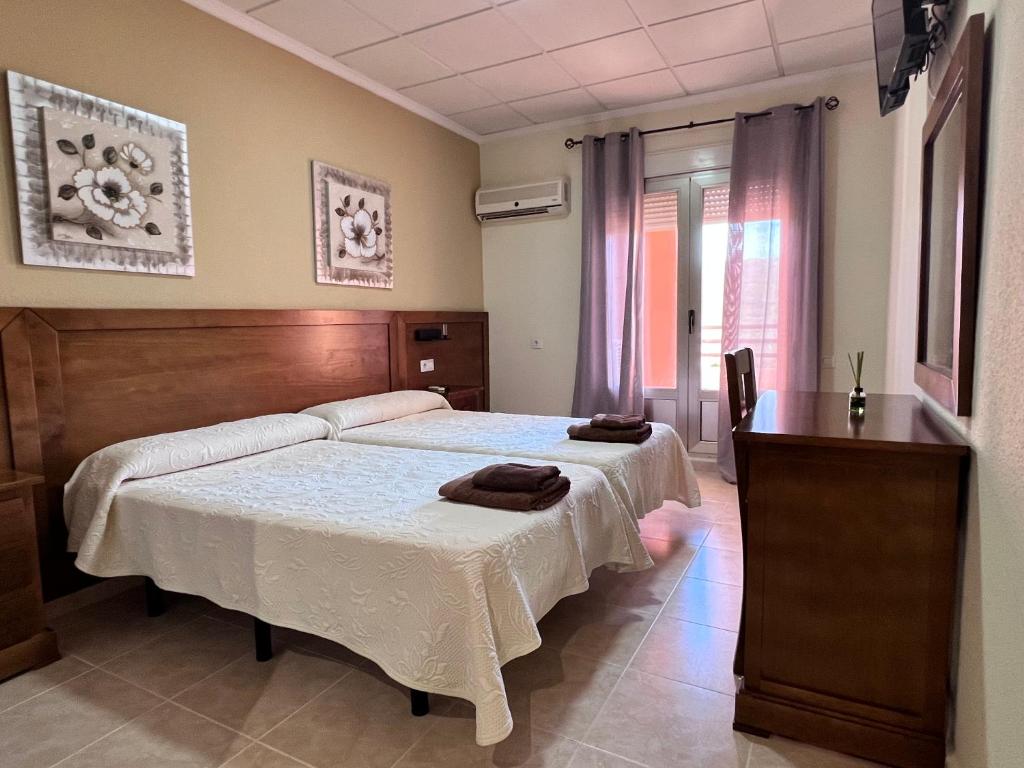 Postel nebo postele na pokoji v ubytování Hotel Don Juan