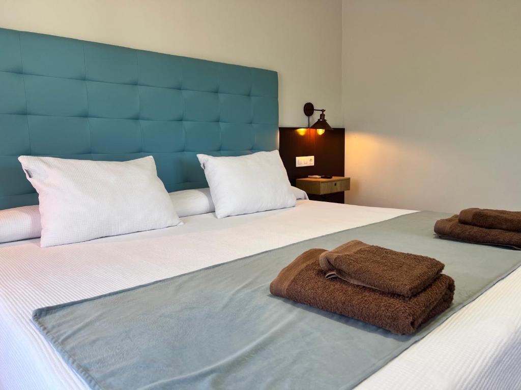 Postel nebo postele na pokoji v ubytování Hotel Don Juan