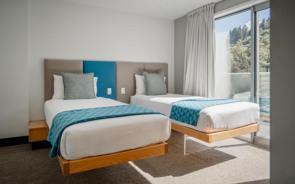 Postel nebo postele na pokoji v ubytování mi-pad Queenstown