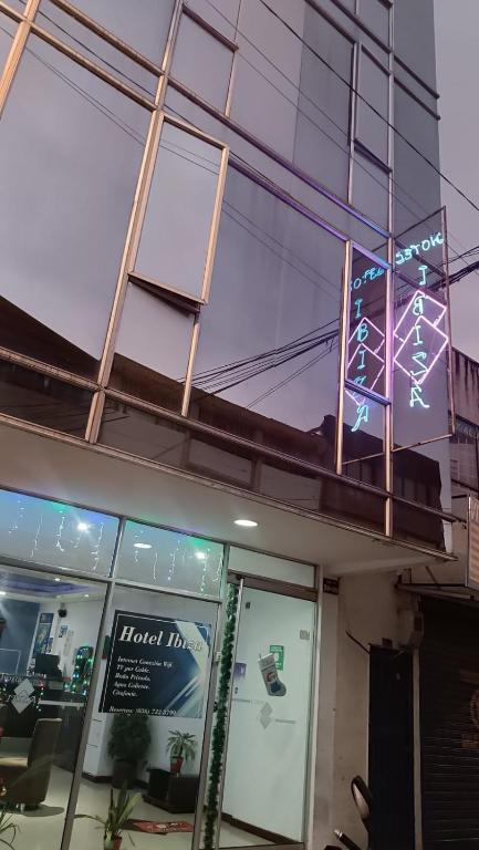 a store front with a sign in the window at Hotel Ibiza in Armenia