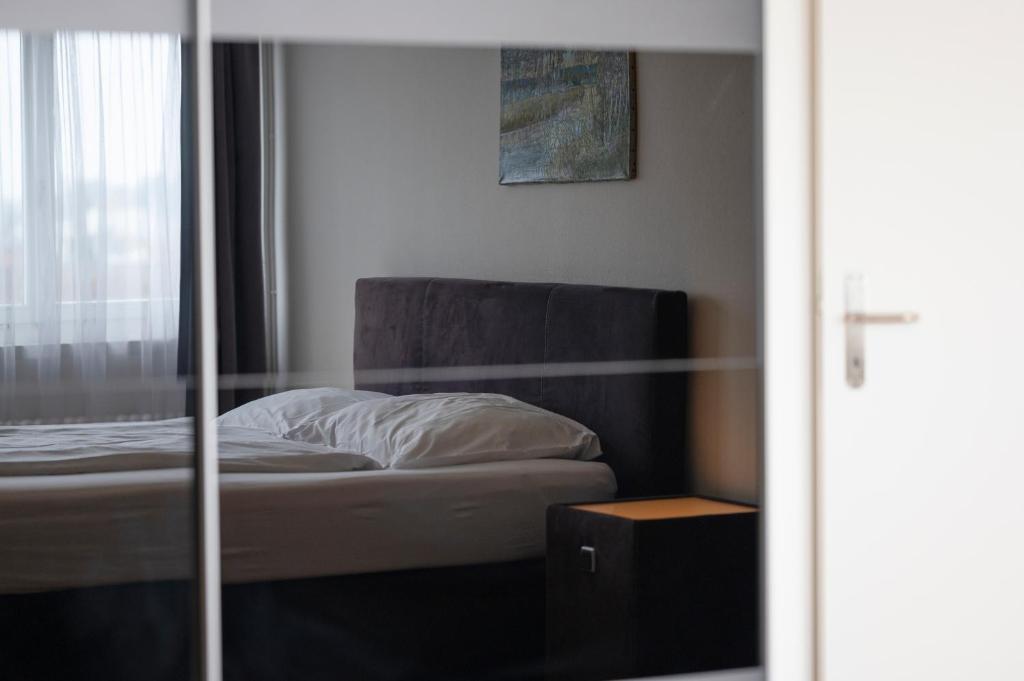 Postel nebo postele na pokoji v ubytování Amanthos Living Solothurn