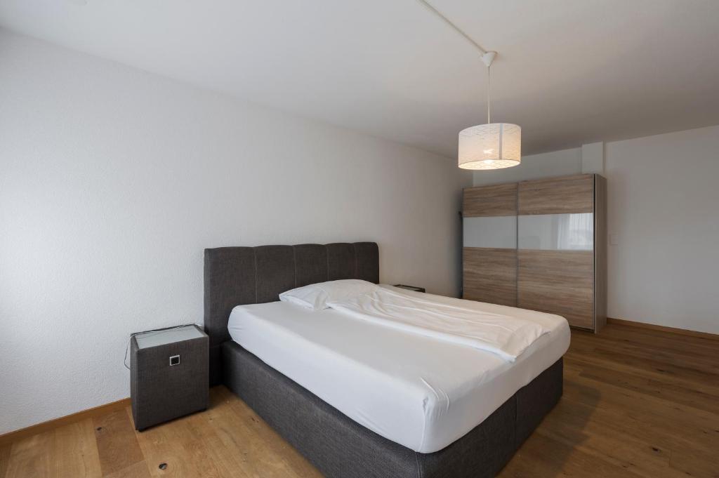 Postel nebo postele na pokoji v ubytování Amanthos Living Solothurn