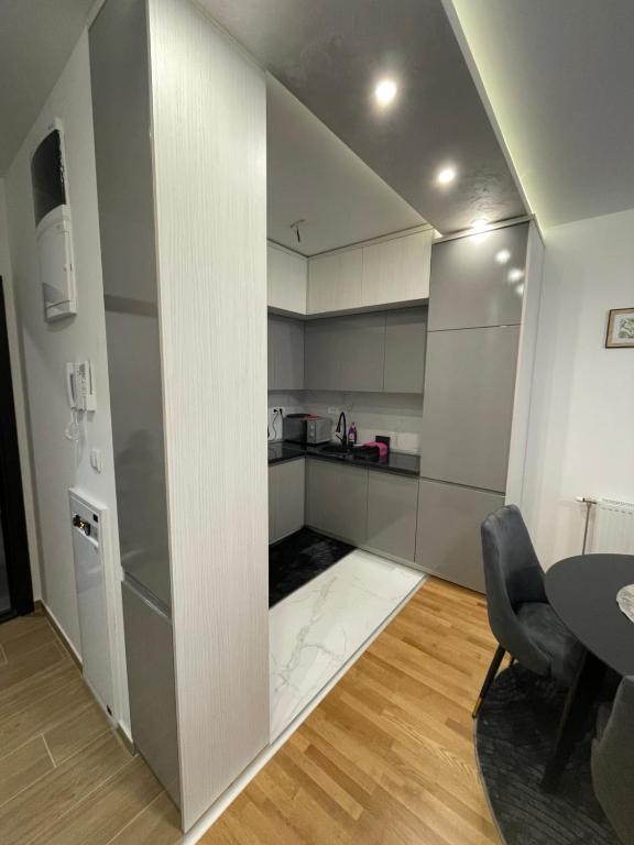 Kuchyň nebo kuchyňský kout v ubytování Ria apartman