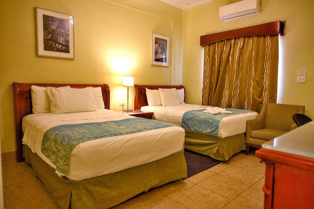 Postel nebo postele na pokoji v ubytování Rolson Hotel