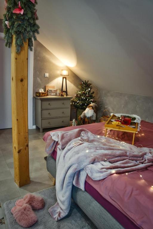 Postel nebo postele na pokoji v ubytování Apartmany pod Pustevnami