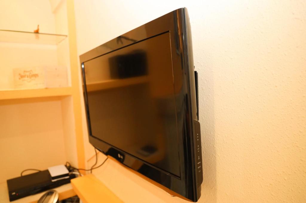 Televízia a/alebo spoločenská miestnosť v ubytovaní Villa Pirata